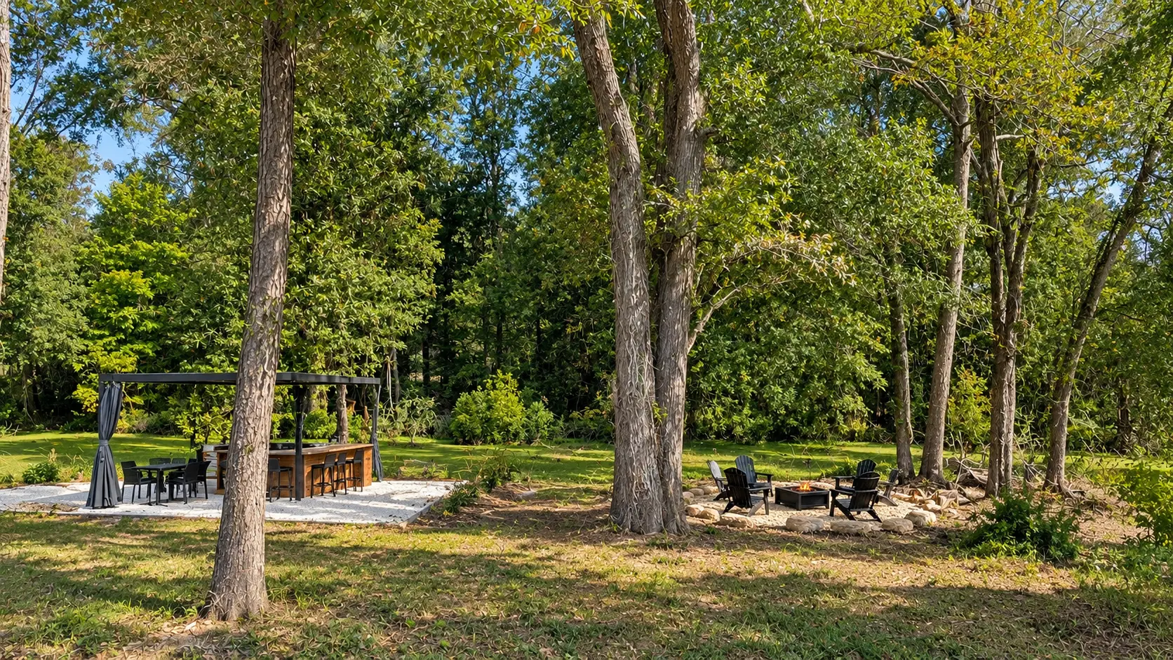 Woodland pergola, outdoor kitchen and fire pit at Sage by the Pond